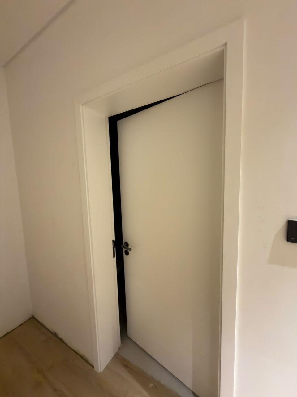 Hidden door open into a bright room, Meydan District One