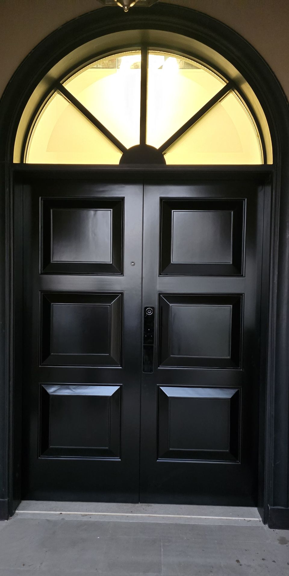 Black Panelled Double Doors With Arched Fanlight
