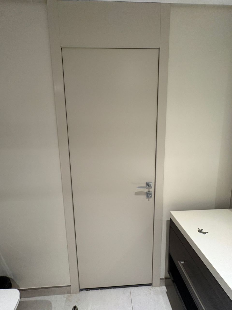 Grey Flush Door With Concealed Frame And Lever