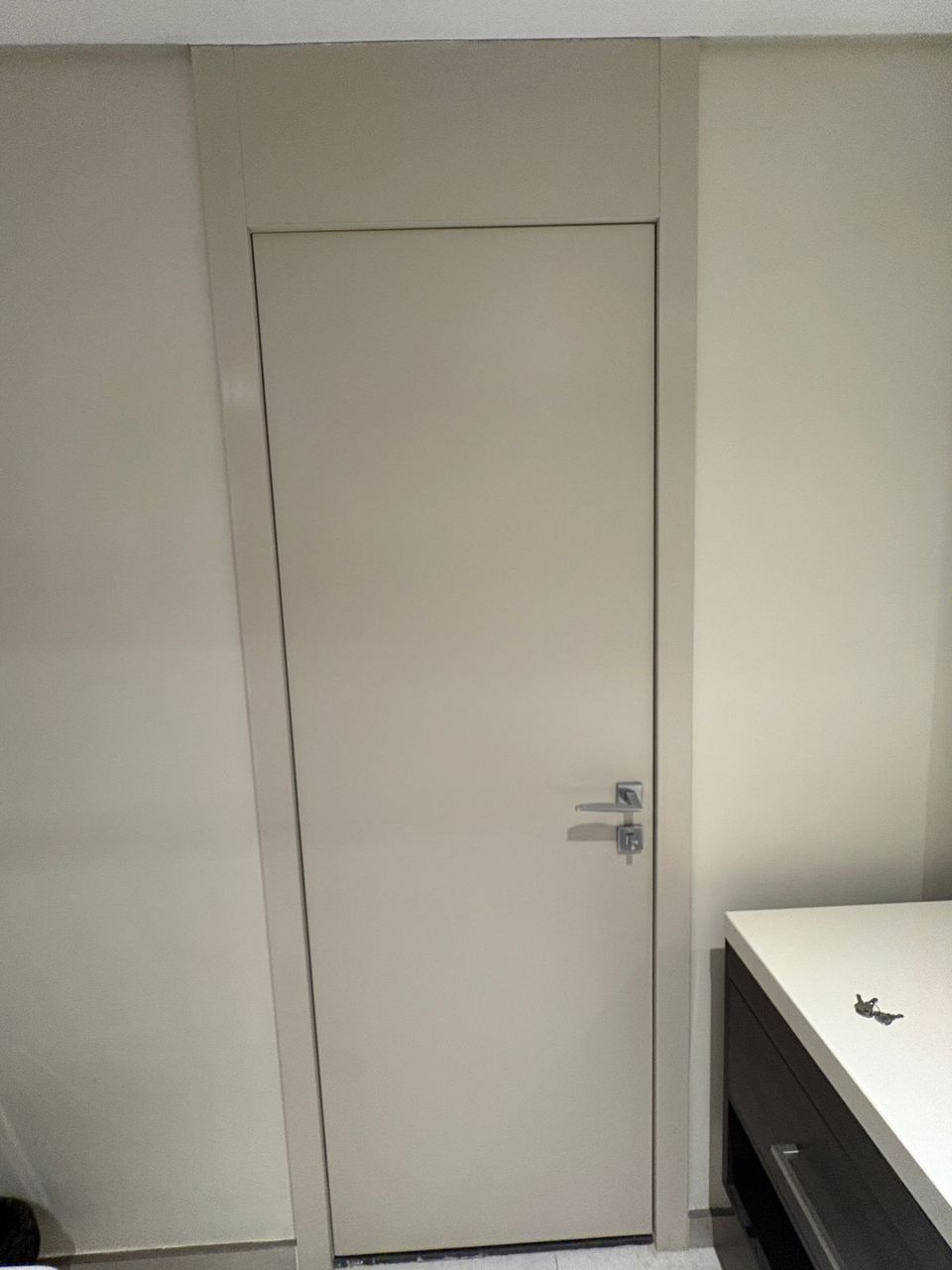 Grey Flush Handleless Style Door In Bathroom