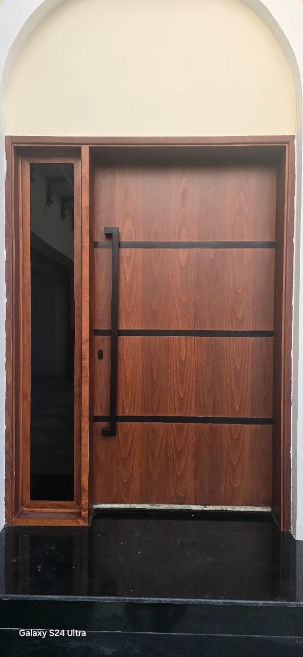 Mahogany main door with long black pull, Jumeirah Golf Estates