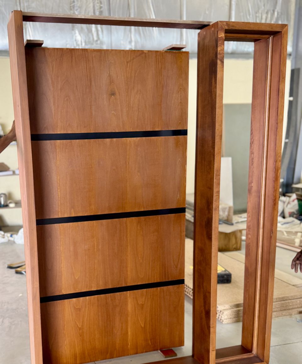Mahogany door leaf with black inlay bars in production