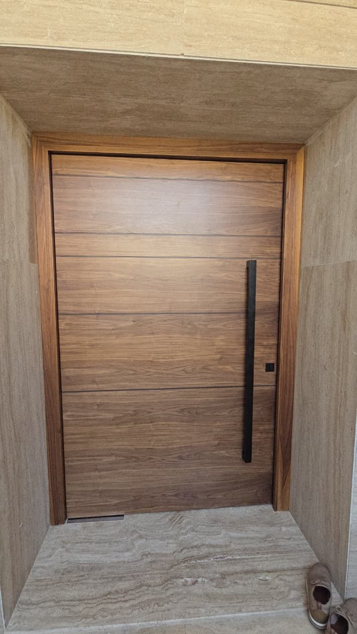 Walnut pivot entrance door, Jumeirah villa