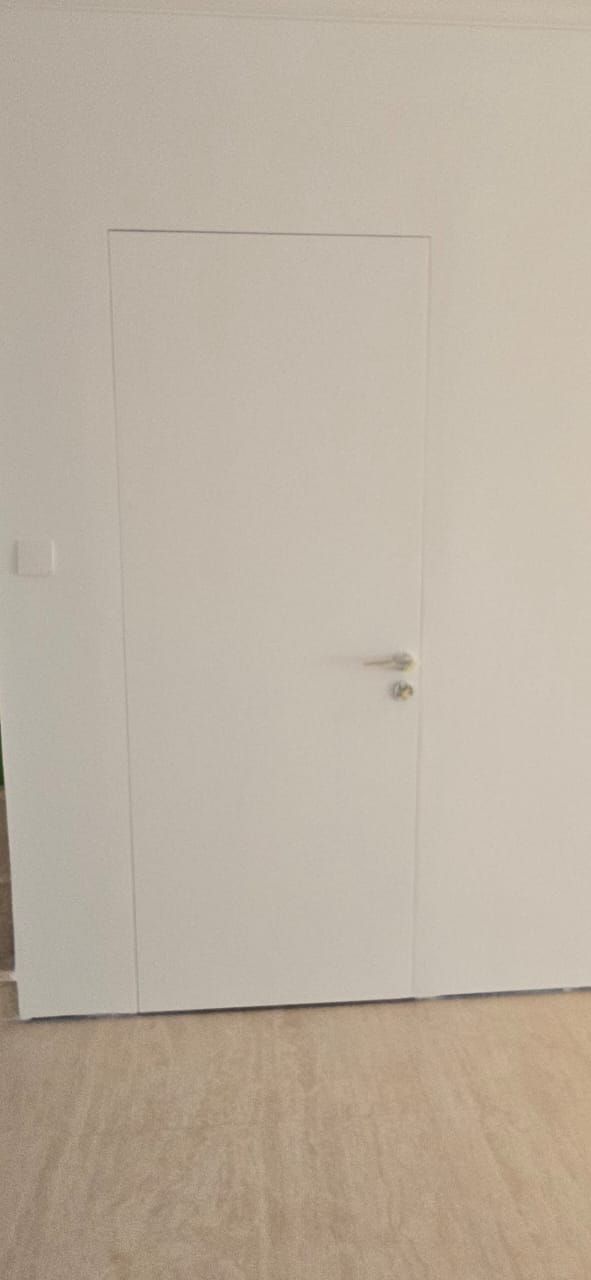 White hidden door flush with the wall, Palm Jumeirah