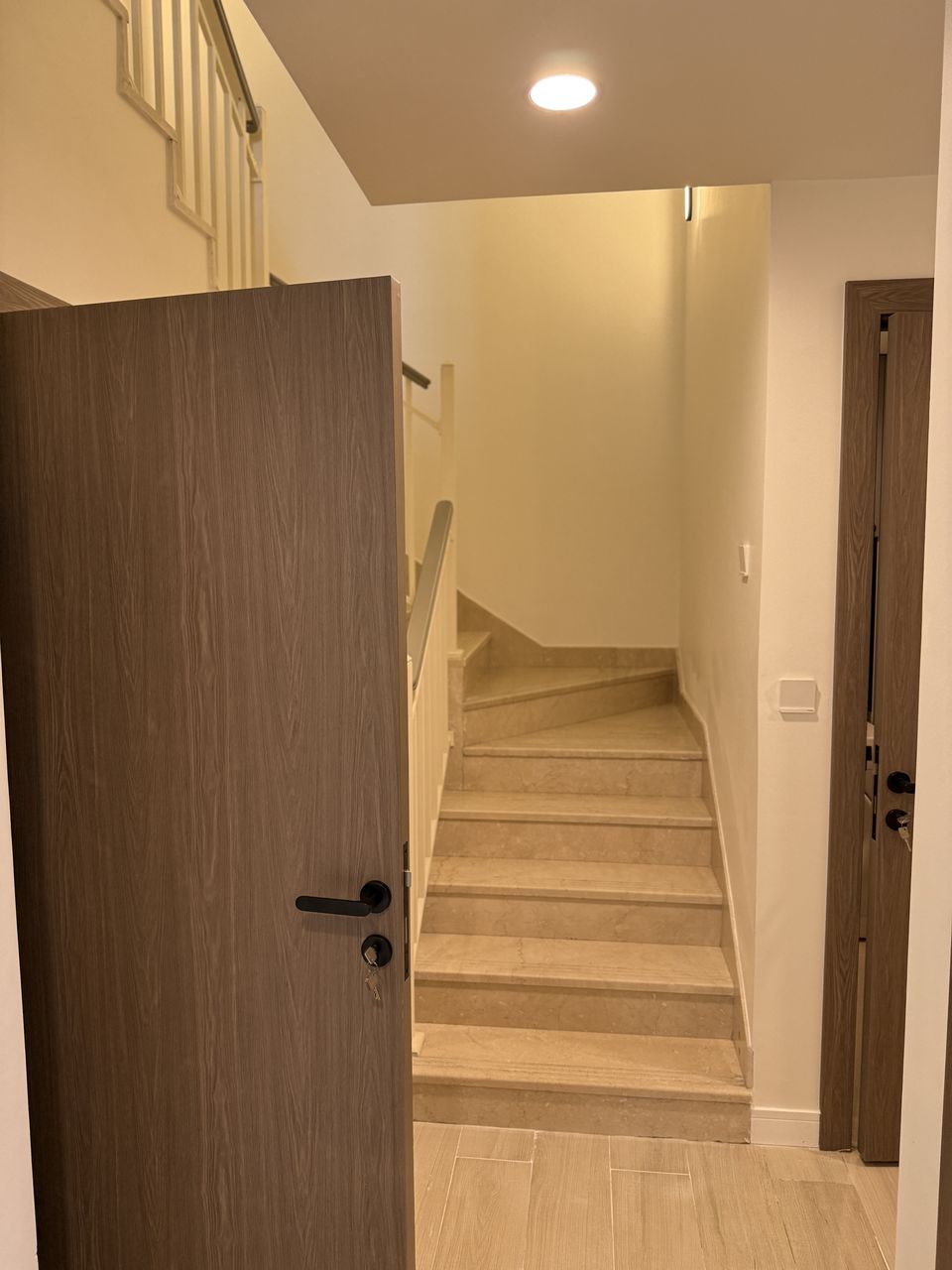 Walnut Door Opening To Staircase