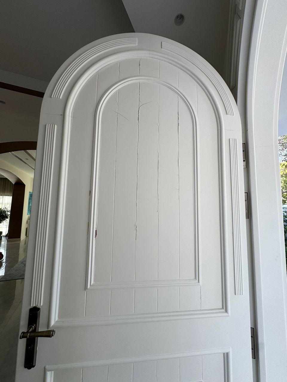 White Arched Panel Door With Black Lever