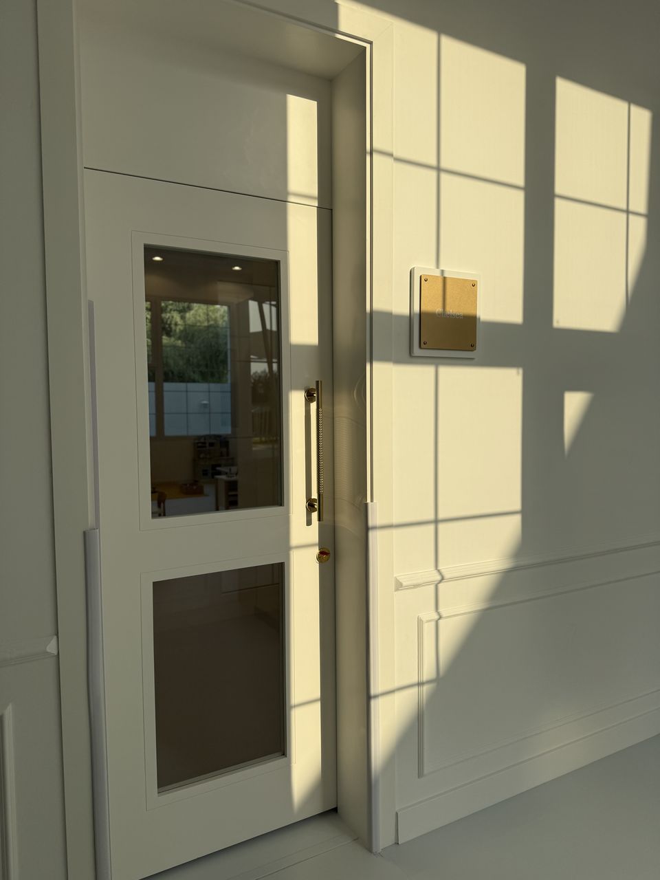 White Glazed Door With Moulding In Sunlight