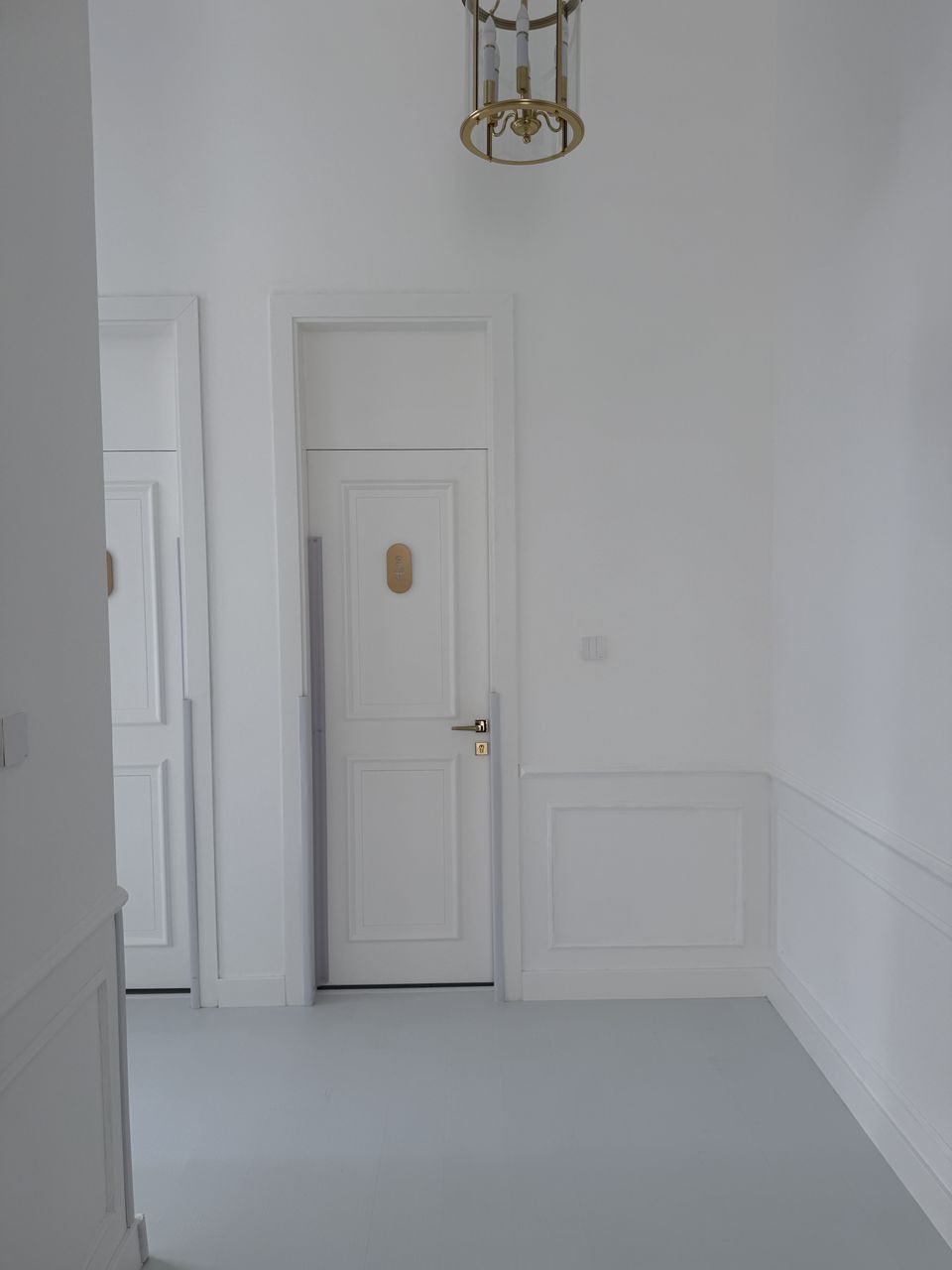 White Panel Doors In Moulded Corridor